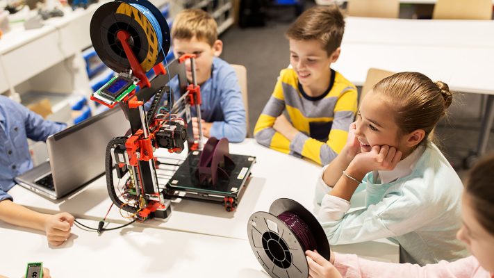 education, children, technology, science and people concept - group of happy kids with 3d printer and laptop computer at robotics school lesson